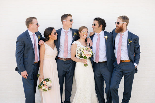 A bridal party poses in Randolph sunglasses, a perfect wedding accessory engineered to last a lifetime. 